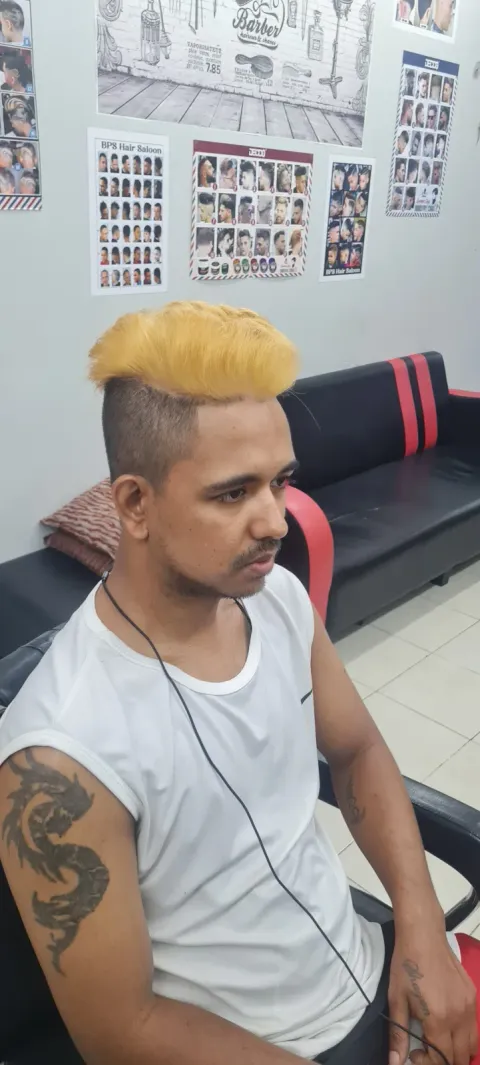 Bleached blonde top with a fade