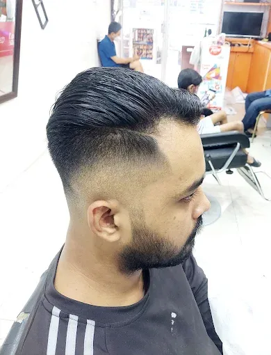 Brush back with a fade and a beard trim