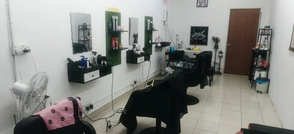 A row of barber chairs inside BPS Hair Salon