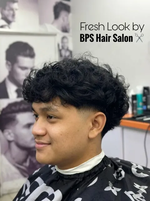 Curly top with a taper fade