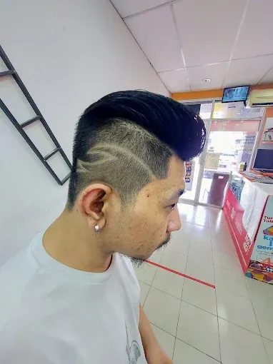 Hair tattoo design cut into a fade