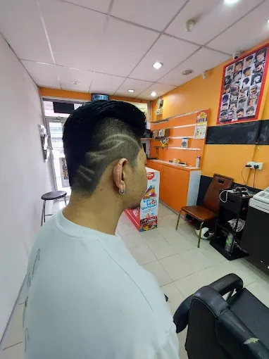 Hair tattoo with curved lines cut into a fade