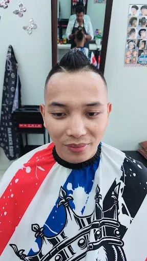High fade with a spiky textured top