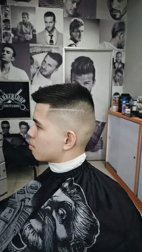 High skin fade with a hard part