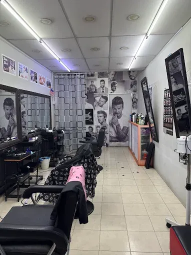 Inside BPS Hair Salon: barber chairs facing a long mirror wall