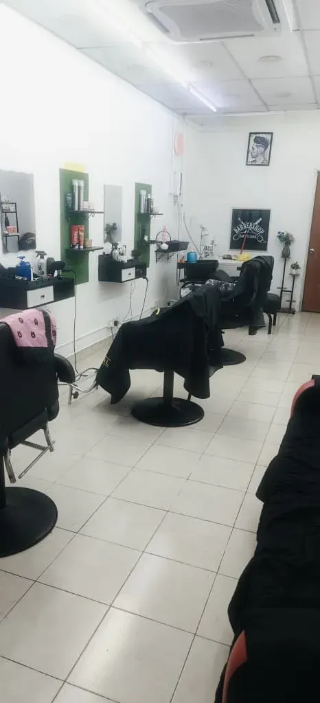 Barber chairs and mirrors inside BPS Hair Salon