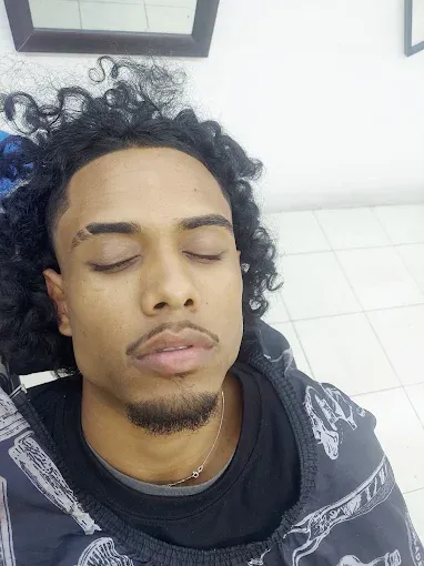 Long curly hair, shaped and trimmed