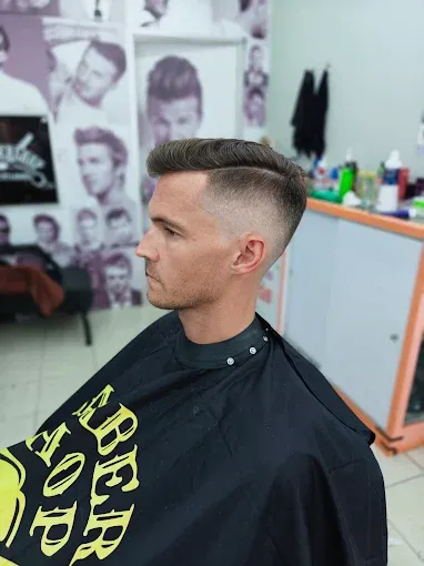 Low fade with the top slicked back
