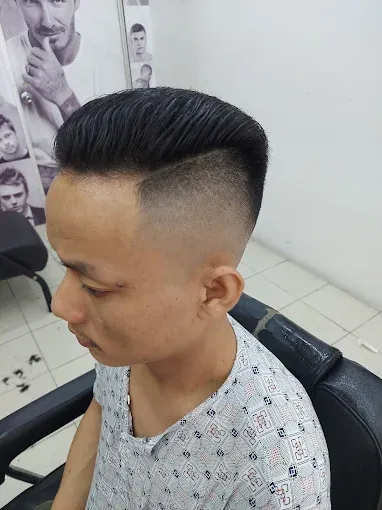 Mid fade with a neat side part
