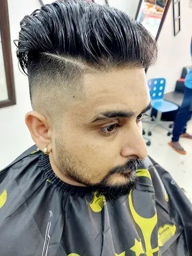 Quiff with a fade and a shaped beard