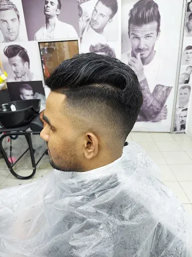 Quiff with a mid fade