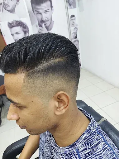 Slicked side part with a fade