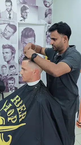 Sundar cutting a customer's hair at BPS Hair Salon