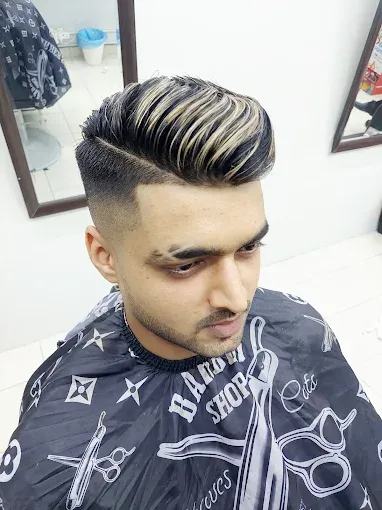 Textured quiff with highlights and a fade