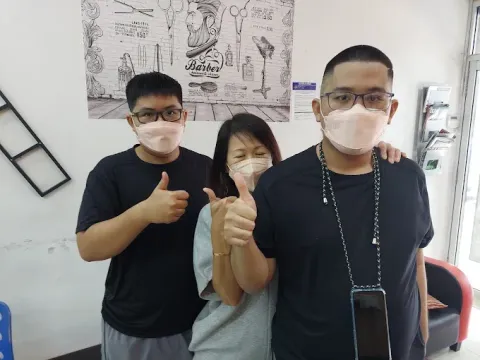 Customers giving a thumbs up in the shop