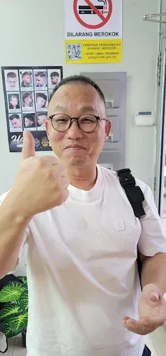 Smiling customer giving a thumbs up